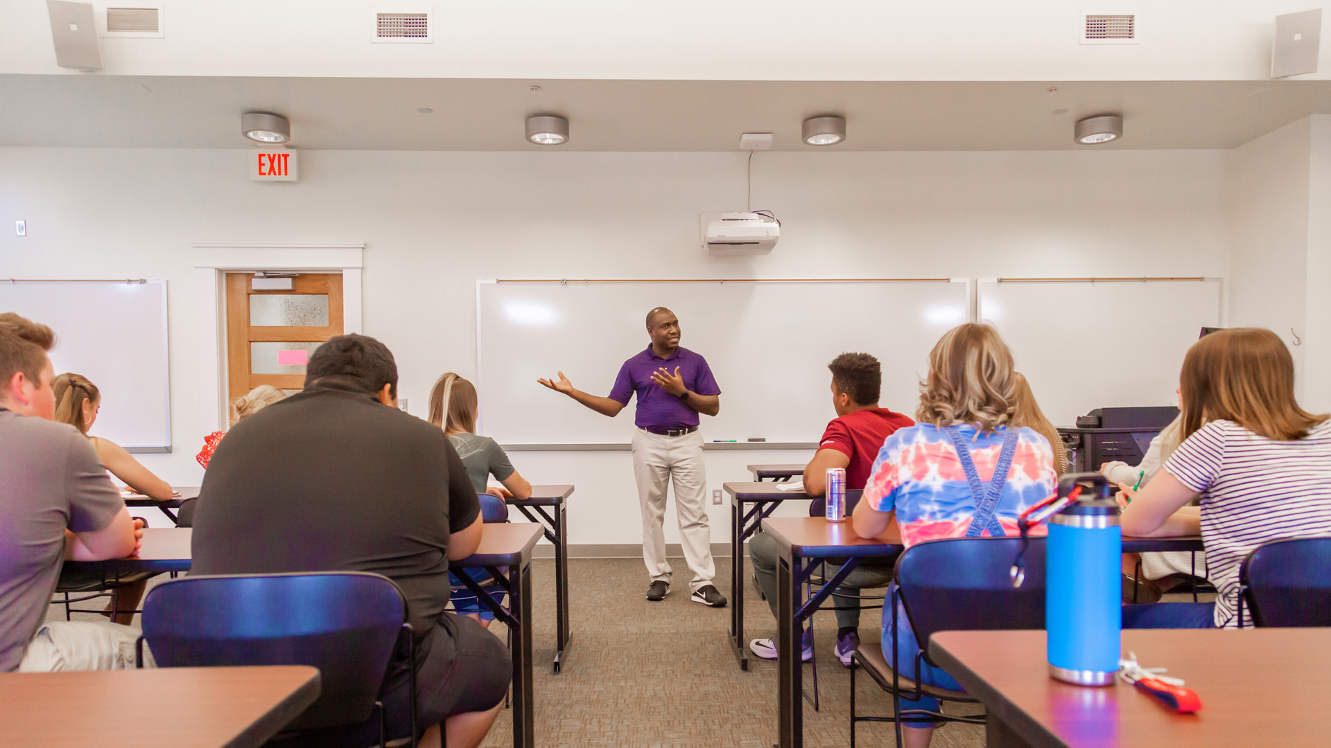 Male faculty giving marketing lecture